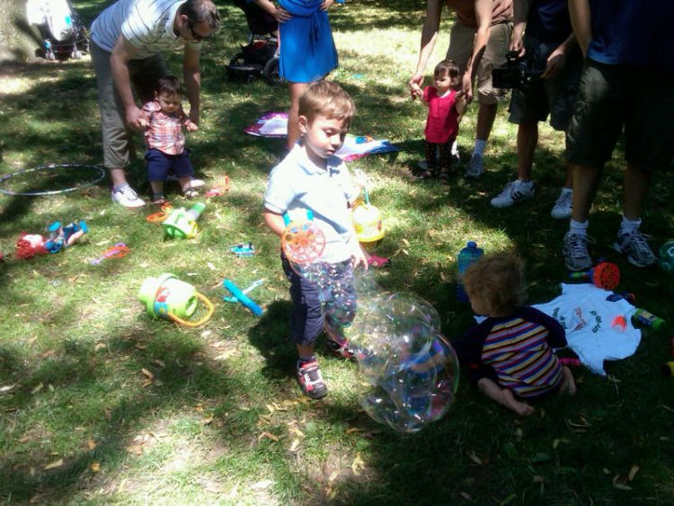 kids playing with bubbles