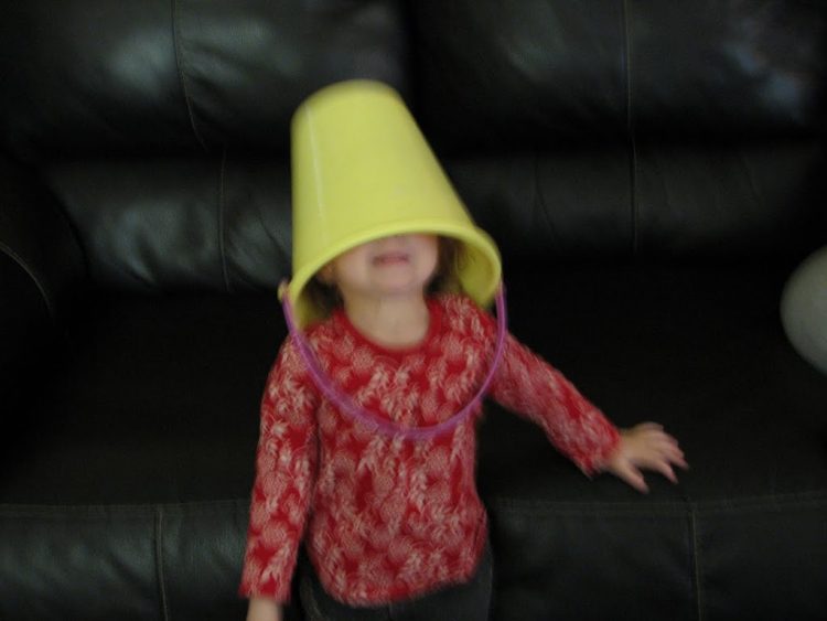 kid with bucket on head
