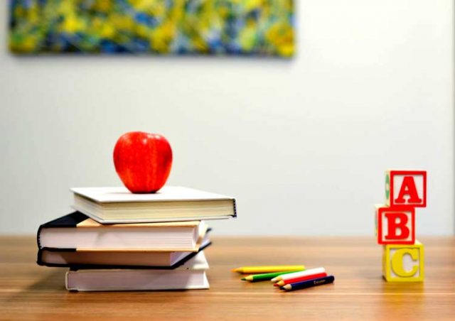 back to school books teacher's desk